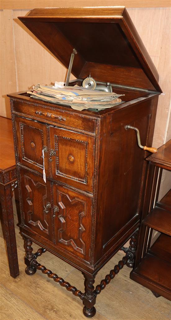 A 1920s oak cabinet, wind-up gramophone and 78 rpm records gramophone W.58cm